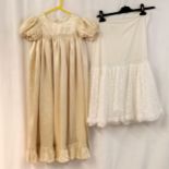 Silk satin childs long dress t/w 1950s cream petticoat. Both in used condition.