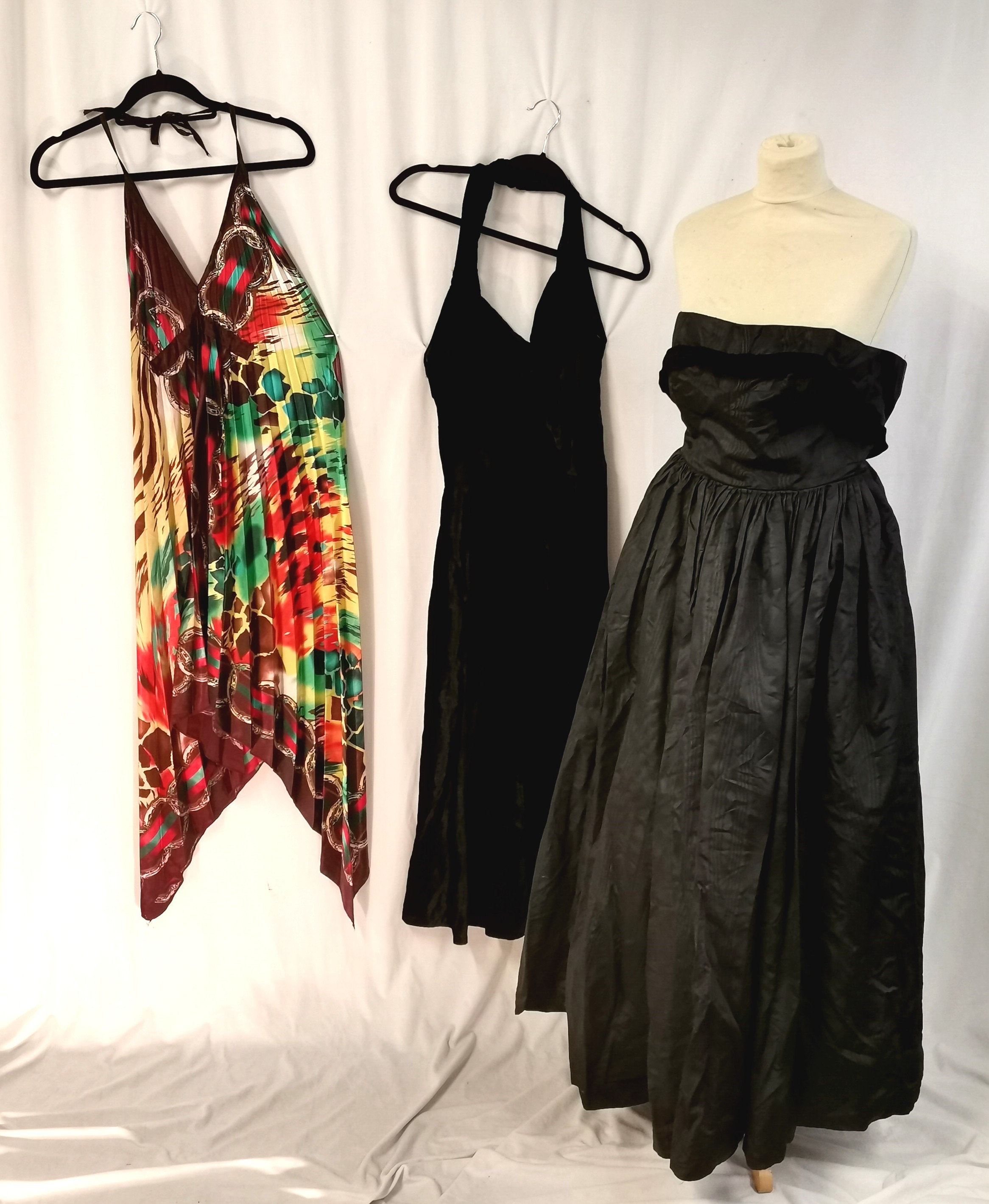 2 1950s Dresses 1 long black satin t/w 1 black velvet mid length in good worn condition.