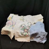 Lot of coloured linen, tablecloths, runners, etc - all in used condition - most with embroidery