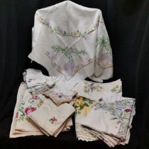 Collection of embroidered linens to include floral patterns hankies. All in good used condition.