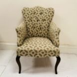 Ladies cream and patterned button back upholstered armchair on slender cabriole legs, in good