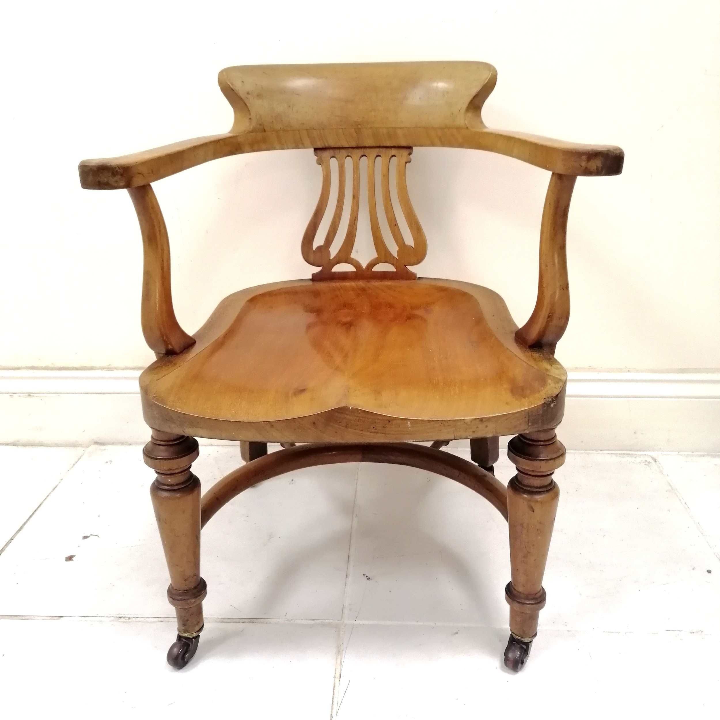 Antique bow back desk chair, on turned legs terminating ceramic castors, in good condition, 53 cm