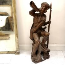 Asian carved hardwood figure of a huntsman with his horn, spear and his dog, 124 cm high x 48 cm