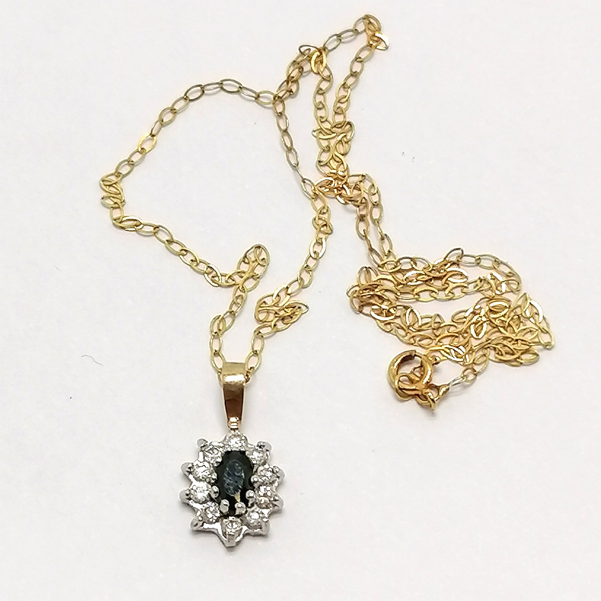 Unmarked gold sapphire & white stone pendant on a fine 9ct marked gold 40cm chain - total weight 1g