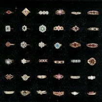 Pad of 36 x 9ct gold stone set rings inc opal, ruby, emerald, diamond, garnet etc - total weight (