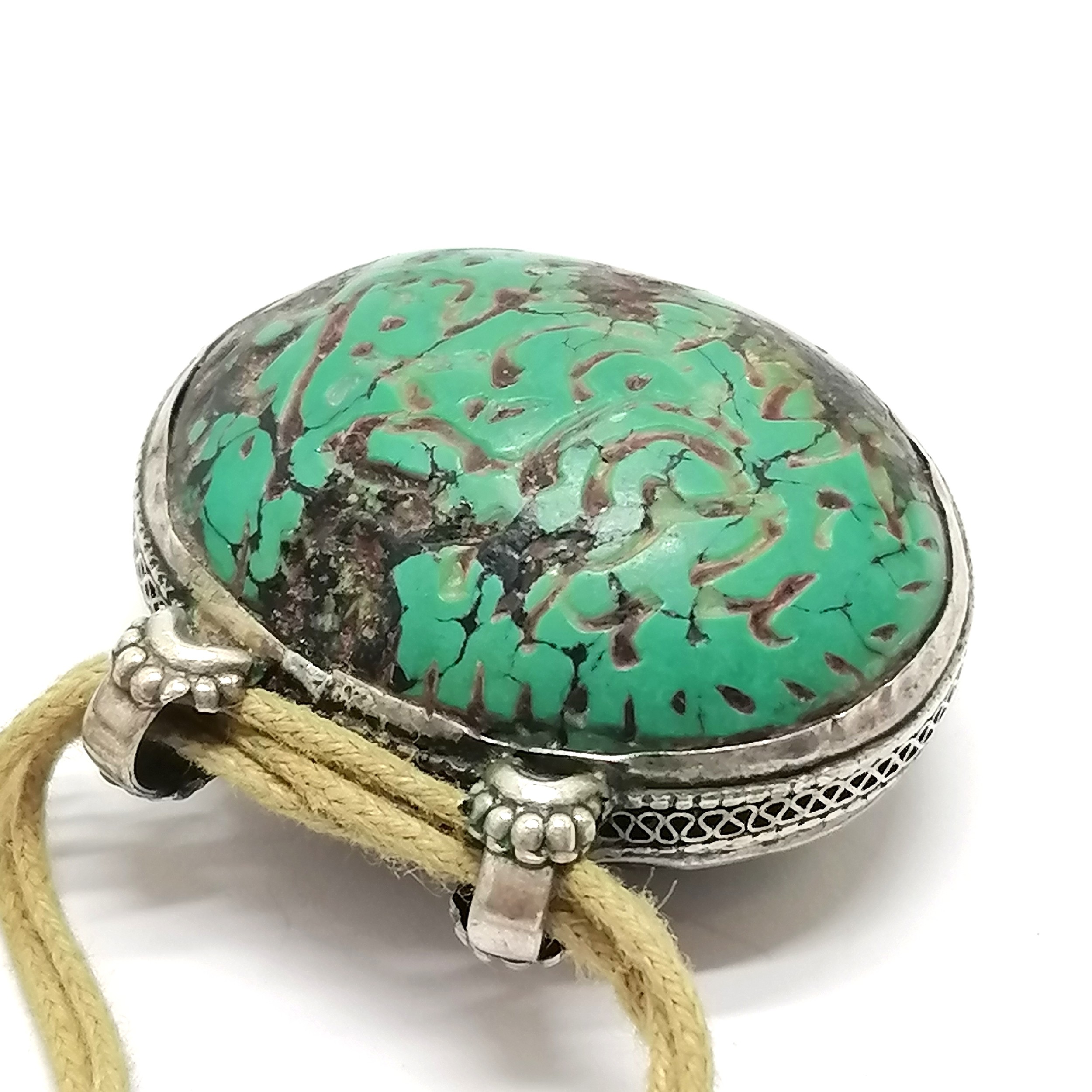 Antique Islamic carved turquoise amulet set in unmarked silver with text to one side and a deer to - Image 2 of 5