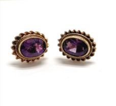 9ct hallmarked gold amethyst stone set earrings with rope twist border - approx 10mm across & 1.6g