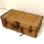 Vintage canvas with leather mounted trunk, bears the initials H C W with original key and makers