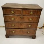 Antique walnut chest of 2 short and 3 long crossbanded graduated drawers & on bracket feet - 99cm