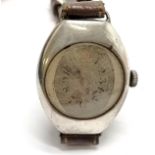 Silver cased oval vintage manual wind wristwatch length of case 3.4cm long - runs but stops