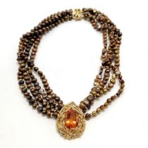 4 strand coloured pearl necklet with unmarked silver gilt pendant set with yellow stone - 42cm