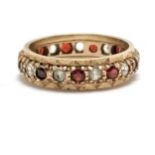 9ct hallmarked gold eternity ring set with garnets & white stones - size N & 2.3g total weight