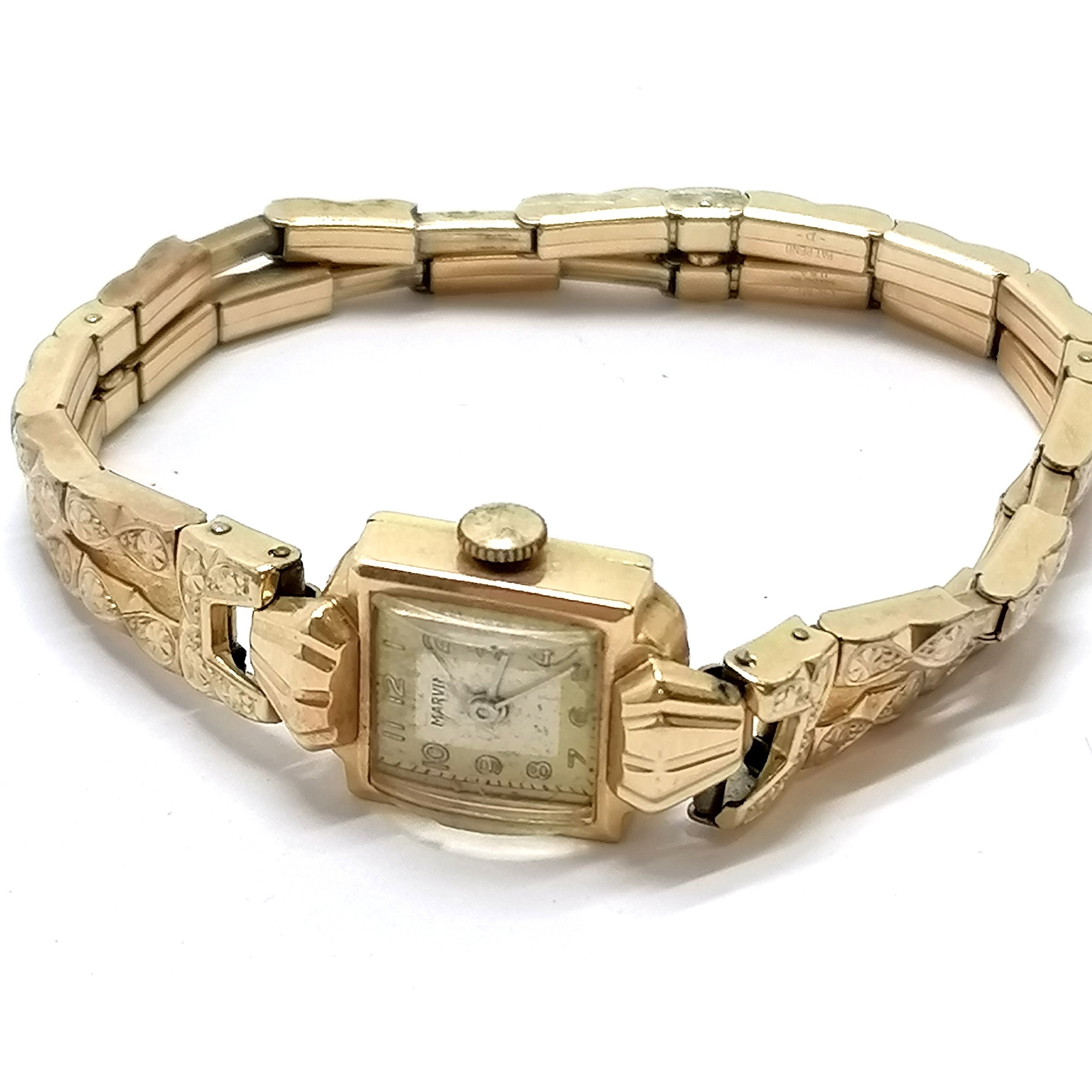 14ct gold cased Marvin Art Deco manual wind wristwatch (14mm across) on a non-gold stretchy bracelet