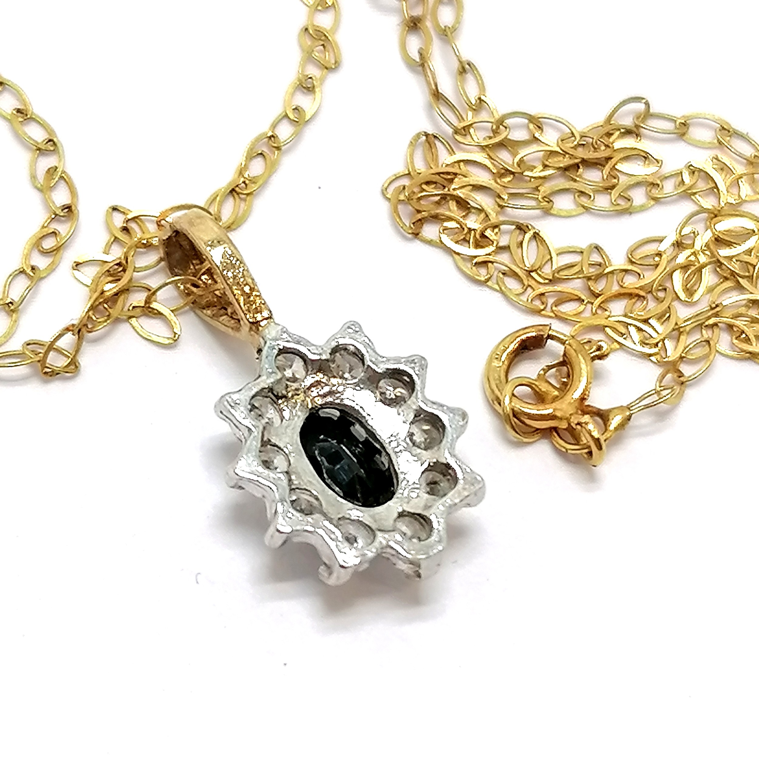 Unmarked gold sapphire & white stone pendant on a fine 9ct marked gold 40cm chain - total weight 1g - Image 2 of 3