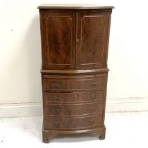 Mahogany reproduction chest on chest, top having 2 door cupboard, base fitted with slide and 1 short