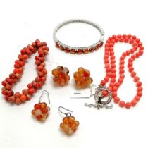 Silver orange stone set bangle (6cm internal across & 19.8g total weight) t/w strand of coral