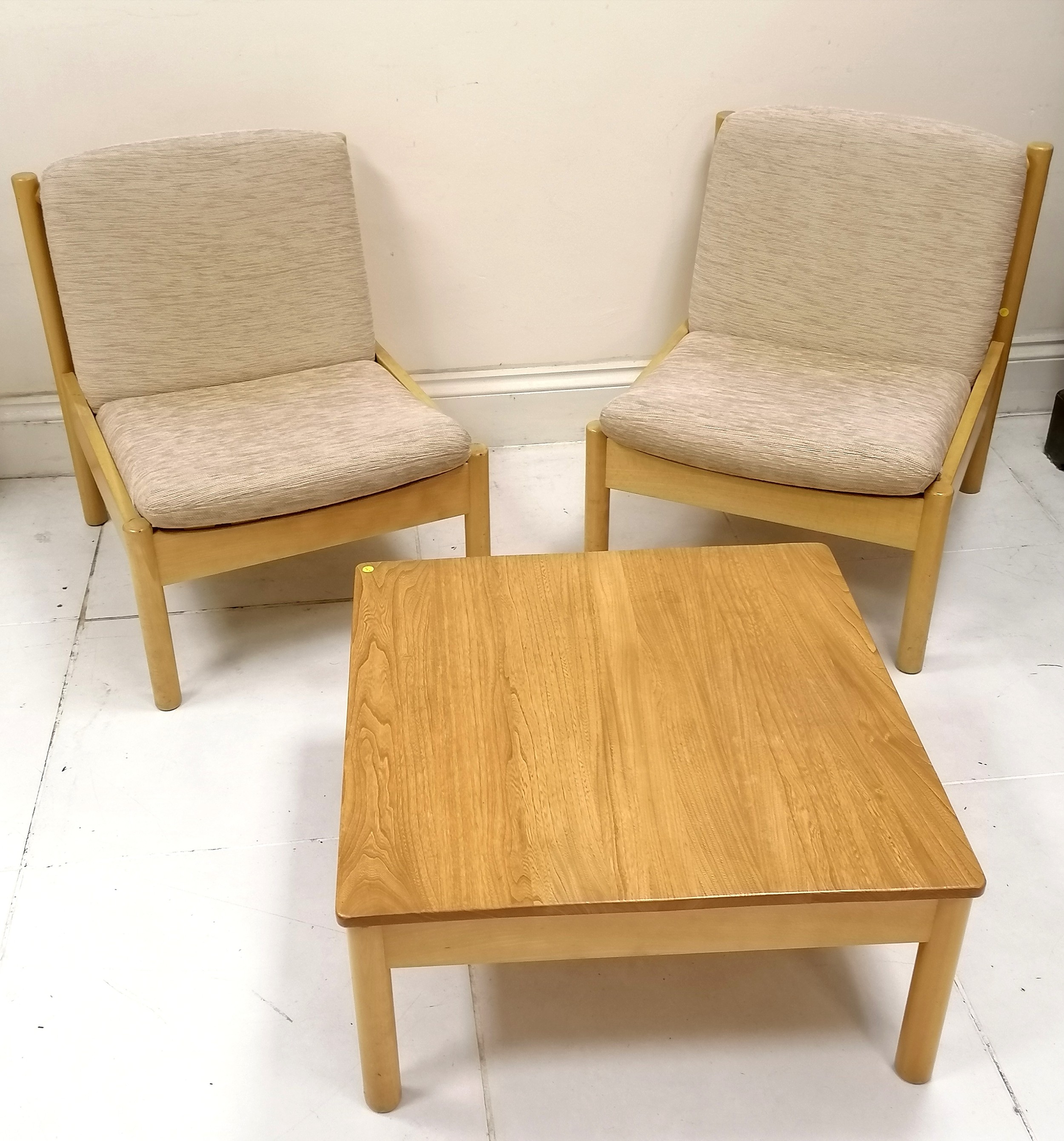 Pair of Blonde Elm Ercol easy chairs, with original oatmeal coloured upholstered cushions. in good