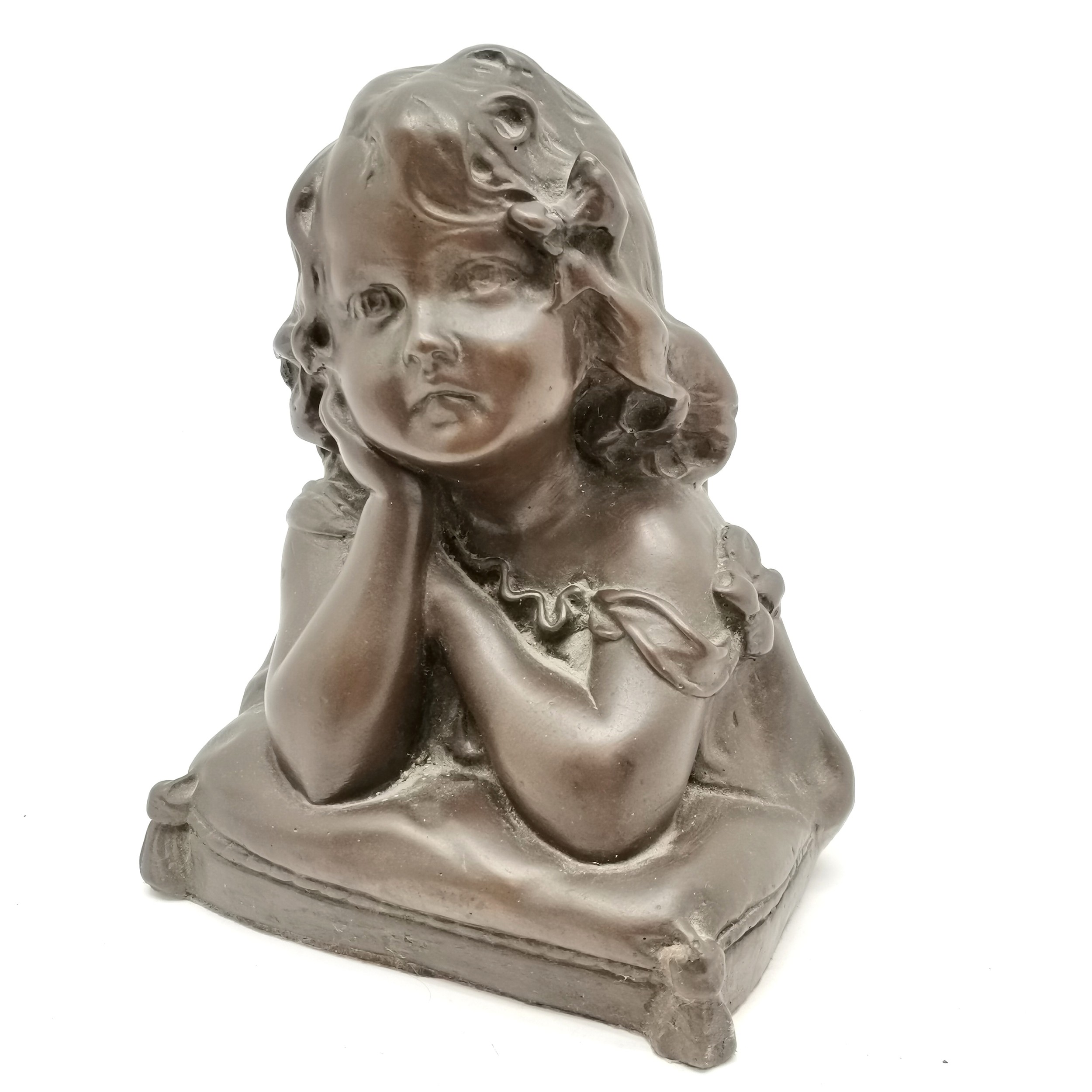 Bronzed resin bust of a little girl resting on a cushion, bears number 161 to reverse, in good