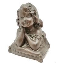 Bronzed resin bust of a little girl resting on a cushion, bears number 161 to reverse, in good