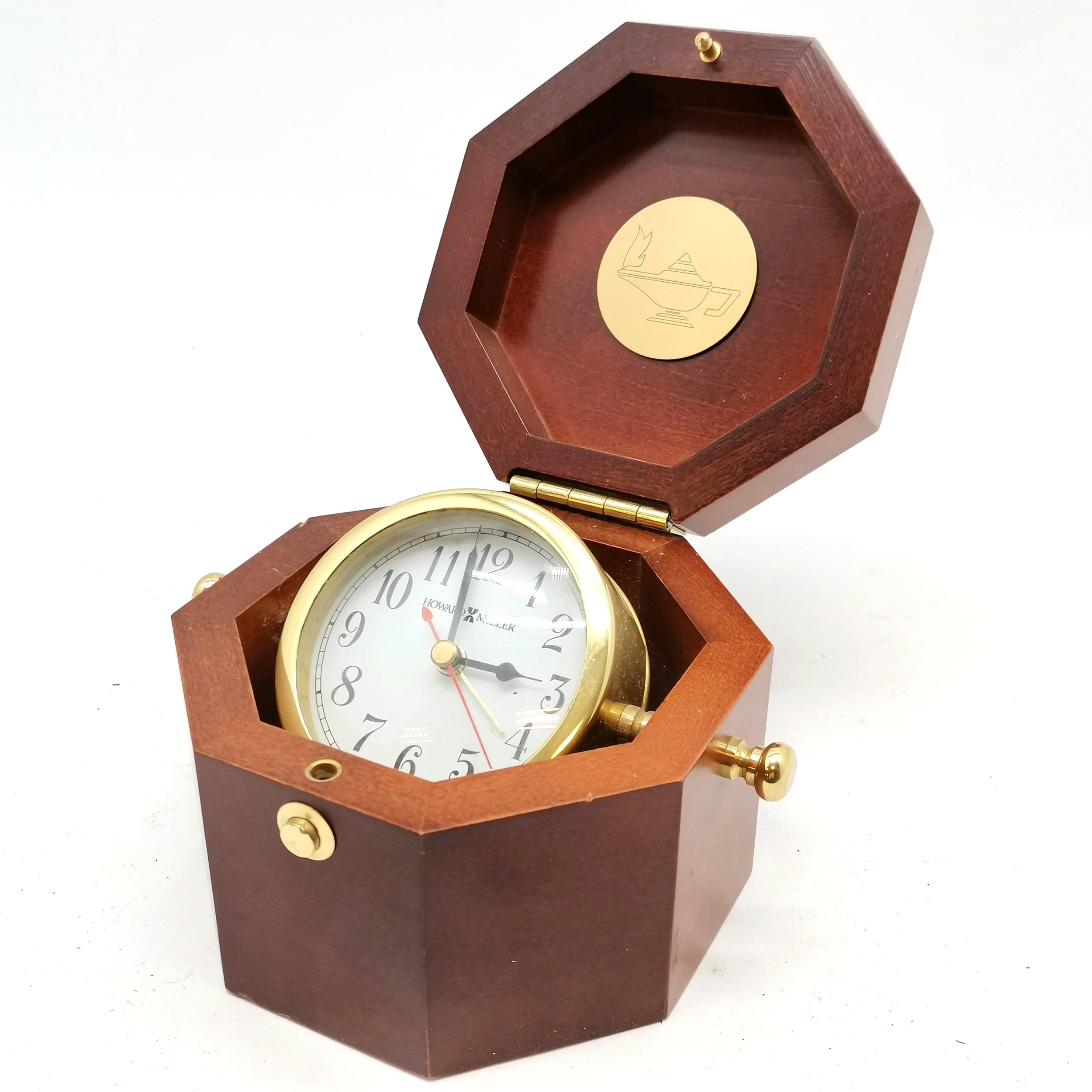 Howard Miller quartz clock in an octagonal wooden box - 14.5cm x 14.5cm x 10.5cm & in used condition