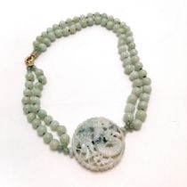 Double strand of jade beads with large pierced & hand carved dragon panel / pendant (5.4cm diameter)