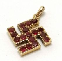 Antique unmarked gold swastika pendant set with rubies - 2cm drop & 1.7g total weight