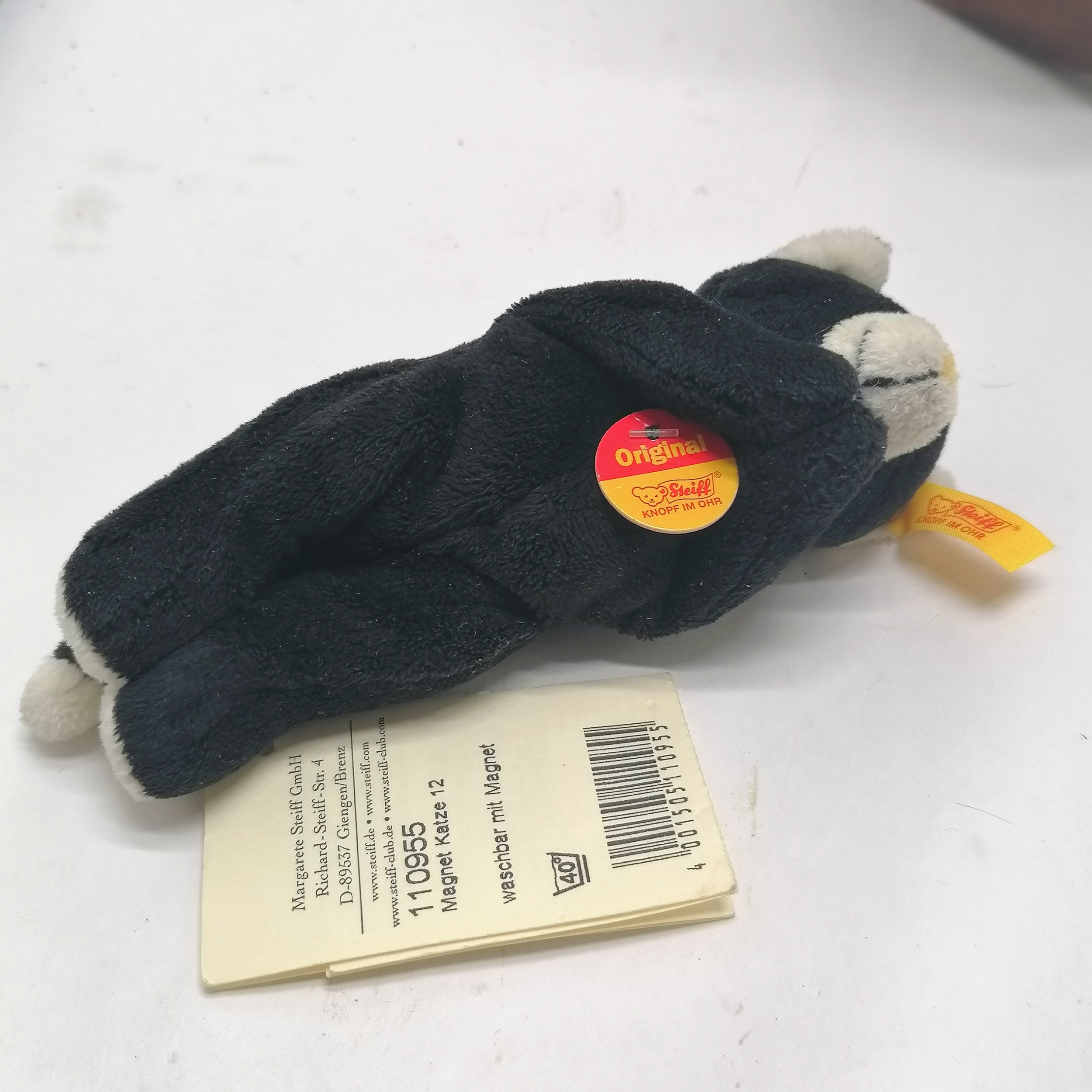 Steiff small black and white teddy toy with original label and tags 13cm long T/W a teddy bear in - Image 2 of 2