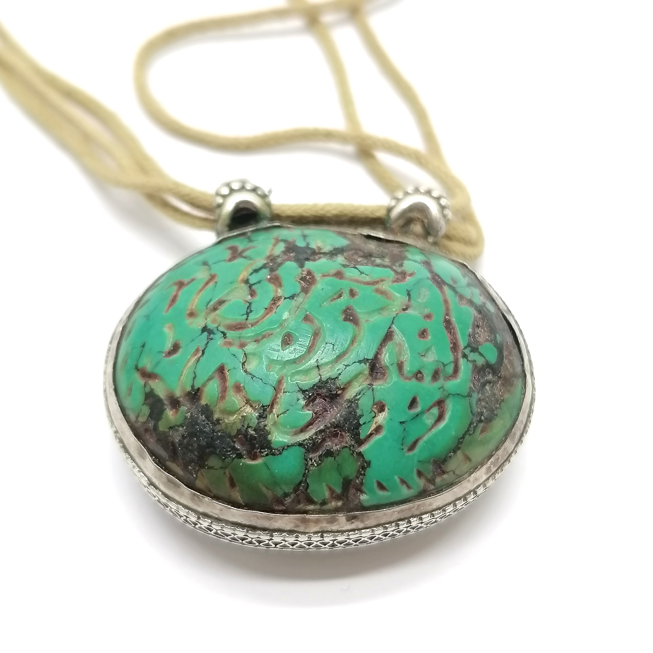 Antique Islamic carved turquoise amulet set in unmarked silver with text to one side and a deer to - Image 5 of 5