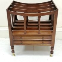 Mahogany reproduction Canterbury fitted with 2 drawers on turned legs terminating on castors, in