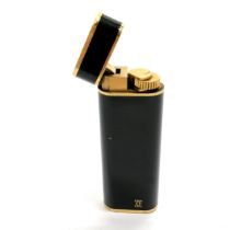 Cartier Plaque Or G black enamel cigarette lighter - 7.1cm long & is in used condition