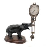 Antique French bronze Elephant pendulum clock on a wooden base 28cm high - the pendulum is bent
