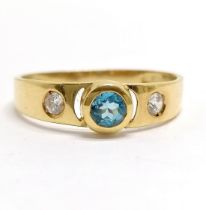 Foreign marked (touch tests as 18ct) blue topaz / white stone set ring - size R & 1.7g total