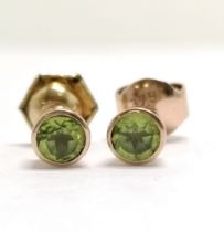 Pair of 9ct marked gold peridot set stud earrings - 4.3mm diameter & 0.9g total weight - SOLD ON