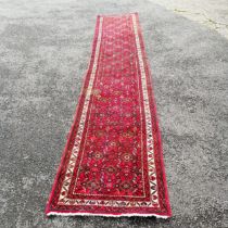 Persian red grounded hand woven wool rug / runner - 412cm x 80cm ~ has mark to 1 part otherwise in