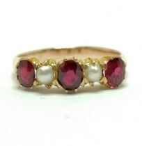 Unmarked gold (touch tests as 14ct) ruby & pearl set ring - size Q½ & 3.1g total weight