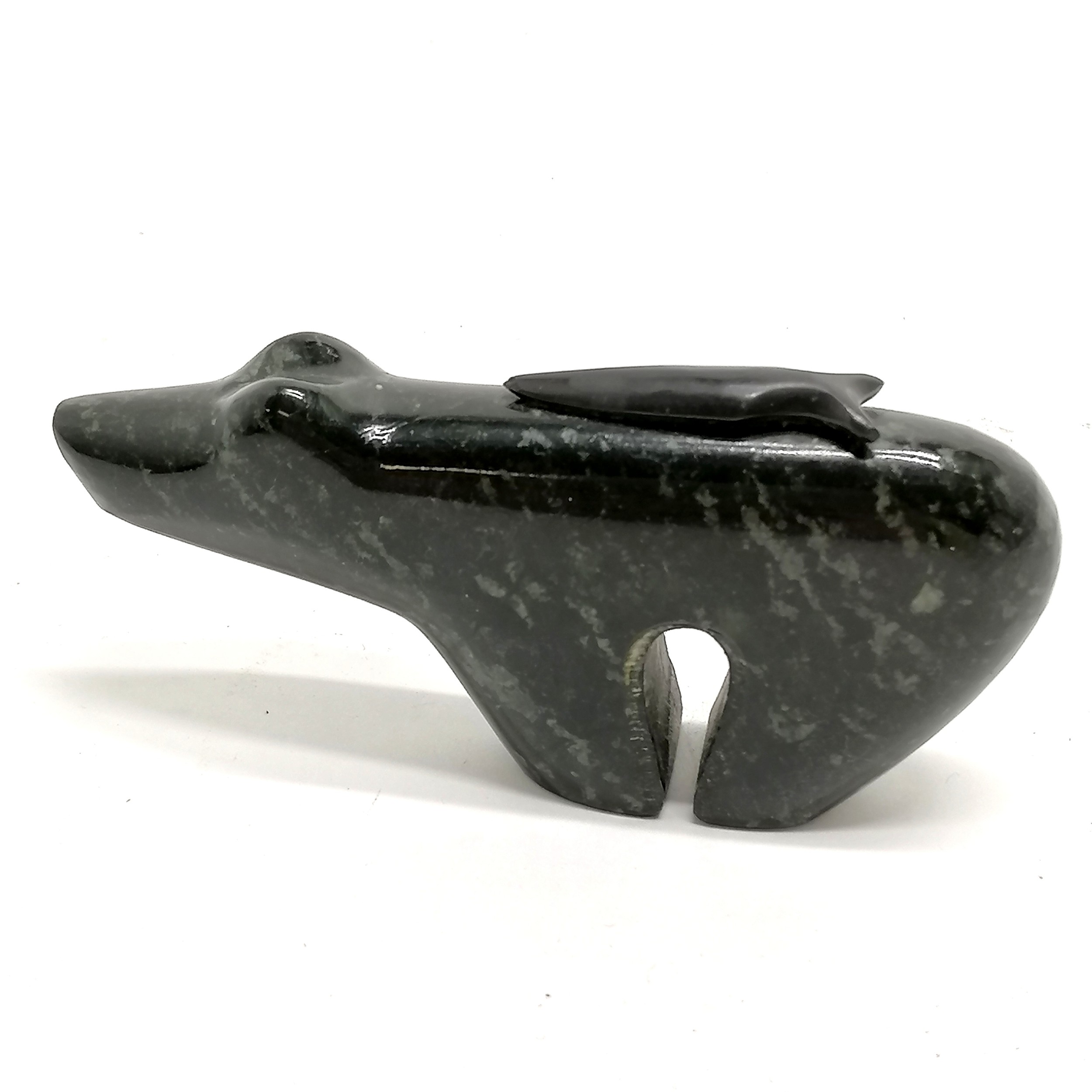 Inuit hand carved polar bear with fish on back by RH - 9.5cm long x 4.5cm high with no obvious