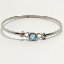 9ct hallmarked white gold bangle set with blue topaz & diamonds - 5.8cm across & 4.2g total weight