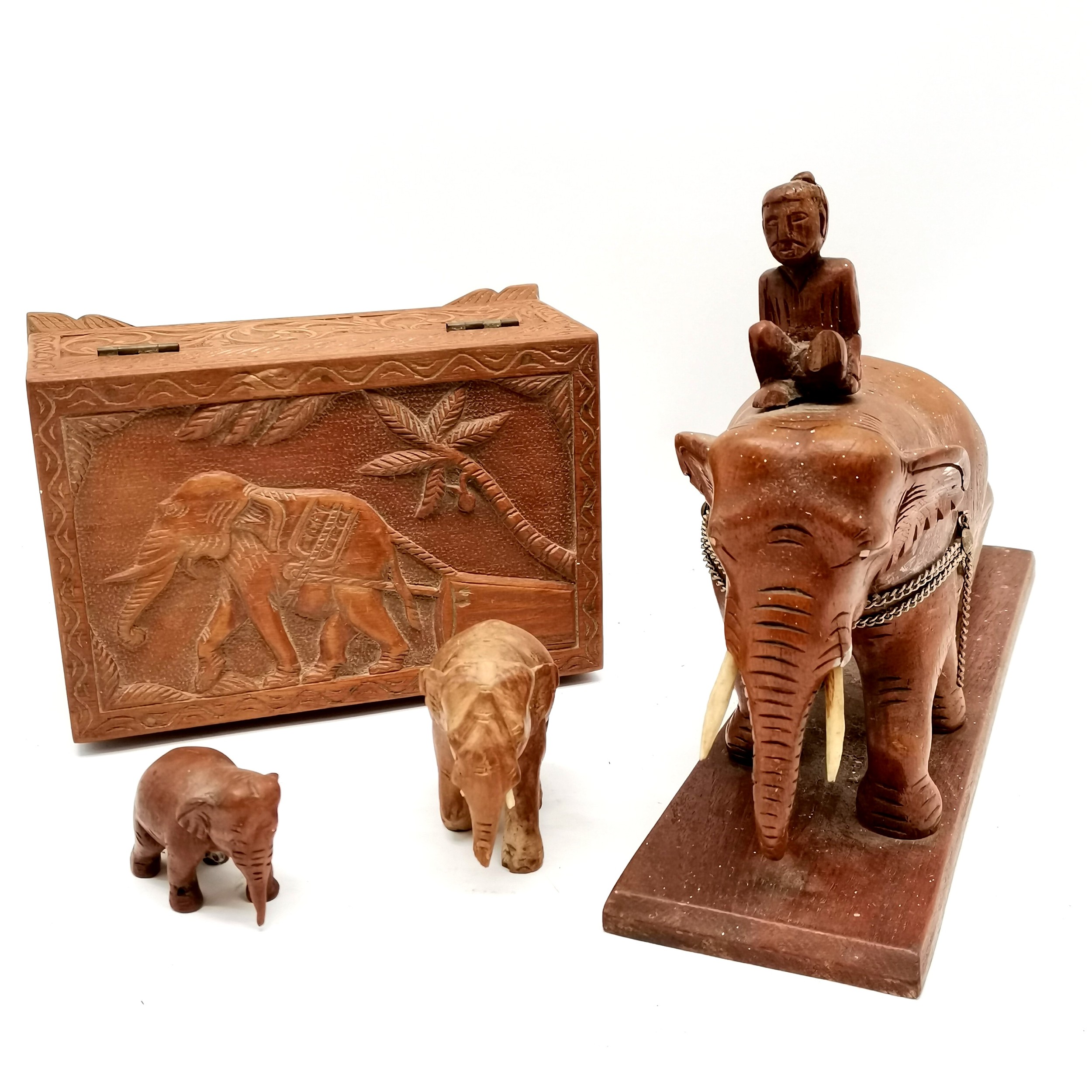 Hand carved teak hinged lidded box depicting elephant dragging log t/w carved model of elephant