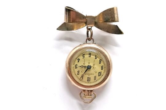 Awoner rolled gold manual wind brooch watch with bow suspender - 4.5cm drop & running at time of - Image 1 of 2