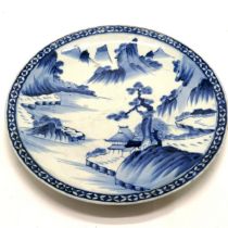 Large antique Oriental wall charger with blue & white decoration of valley scene - 47cm diameter and