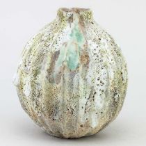† AKI MORIUCHI (born 1947); a stoneware seed pod form with heavily textured surface, impressed mark,