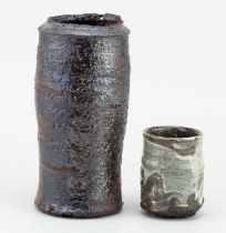 † ADAM FREW (born 1981); a cylindrical wood fired grogged stoneware vase with incised decoration,