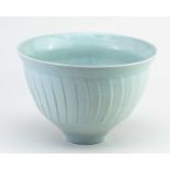 † DAVID LEACH (1911-2005) for Lowerdown Pottery; a fluted porcelain bowl covered in celadon glaze,