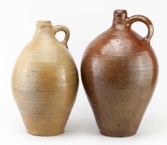 Two 19th century German salt glazed jugs including an example with '3', height 36cm (2). Condition