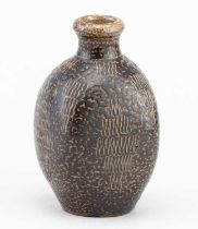 In the manner of MARTIN BROTHERS; a salt glazed vase with incised decoration, height 12.5cm.