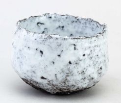 AKIKO HIRAI (born 1970); a stoneware chawan covered in white glaze with iron staining, incised mark,