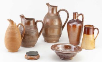 A collection of late 19th/early 20th century salt glazed pieces including three jugs with