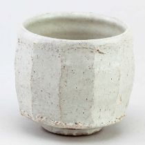 AKIKO HIRAI (born 1970); a faceted stoneware yunomi with textured surface covered in pitted white
