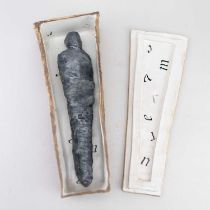 BARBARA FORD; a stoneware coffin containing a mummified body, length 29cm. Provenance: Purchased