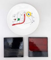 After MIRO; a ceramic plate 'L'Issue Derobee', diameter 25cm, and two modern Tate Gallery tiles (